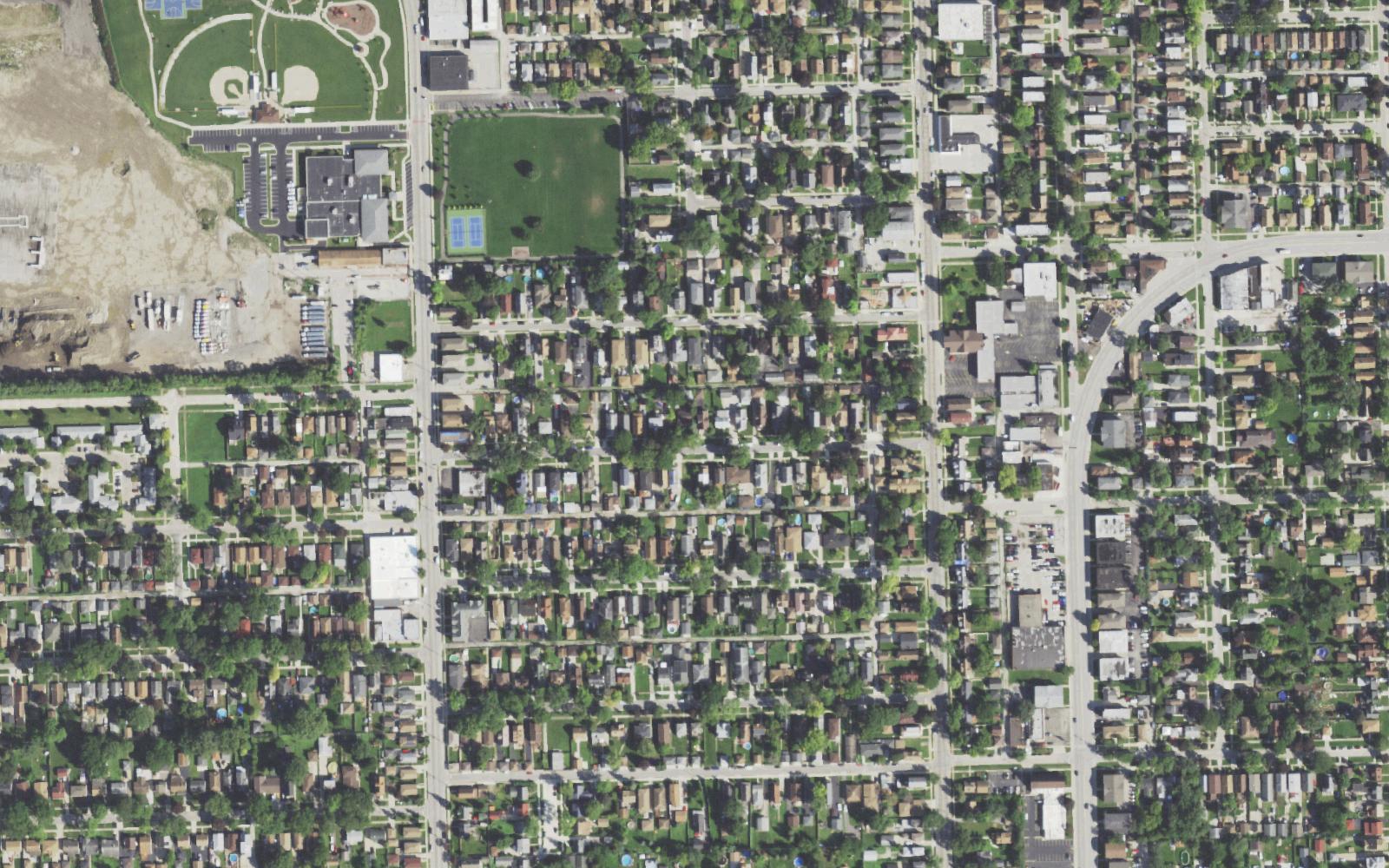 Real aerial of a Lyons, IL neighborhood — a drainage contractor's service area, seen from above