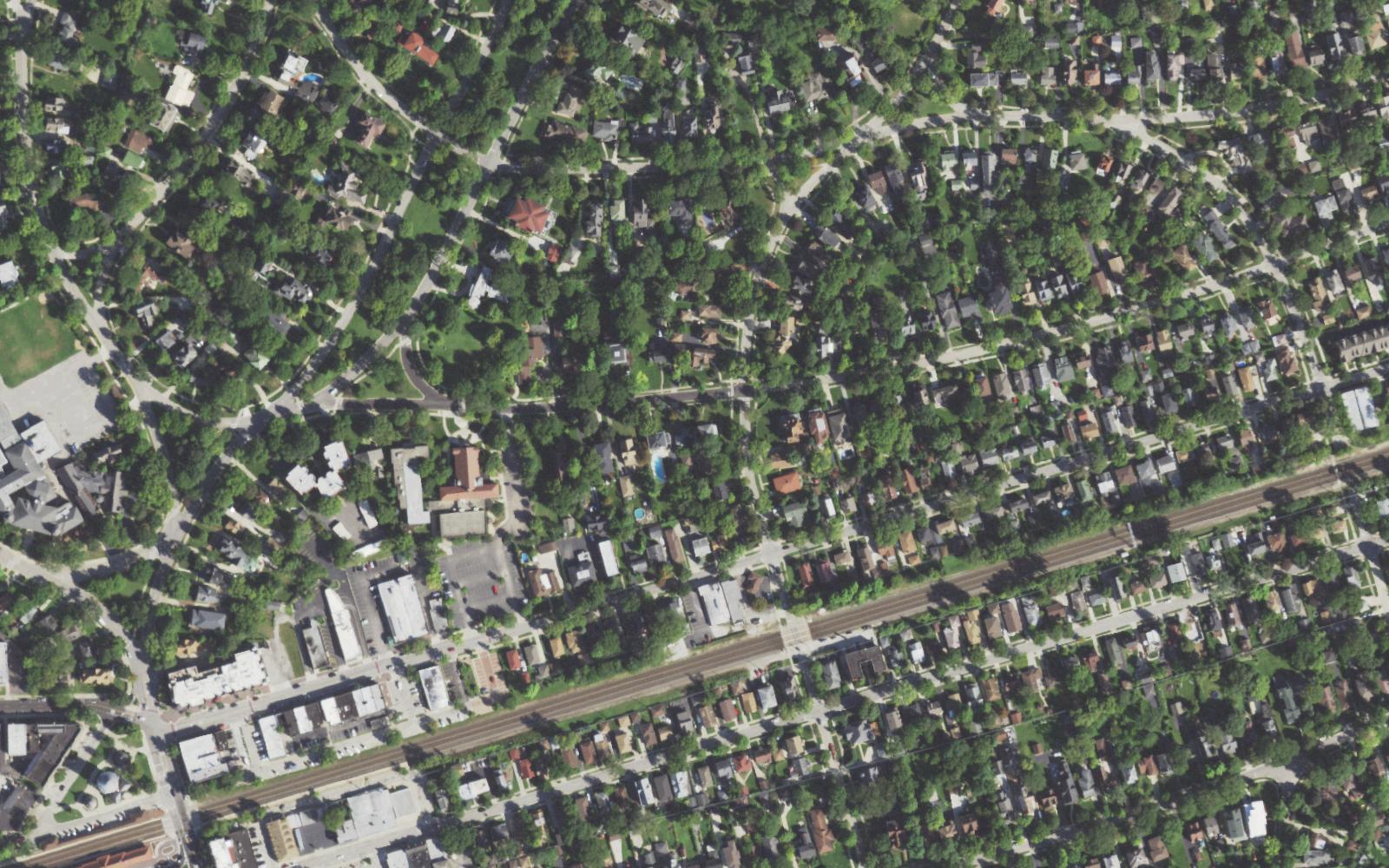 Real aerial of a Riverside, IL neighborhood — a siding contractor's service area, seen from above